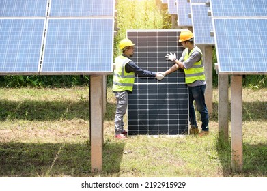 A Team Of Male Engineers Is About To Install Solar Panels. At The Solar Power Station Engineer Team Ordered And Installed Solar Cells.