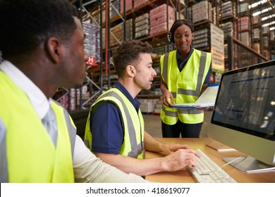 Team managing warehouse logistics in an on-site office
