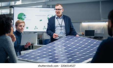 Team Meeting of Renewable Energy Engineers Working on an Innovative More Efficient Solar Panel Battery Concept. Group of Specialists Gathered Around Table, Solving Problems. Bright Research Facility. - Powered by Shutterstock