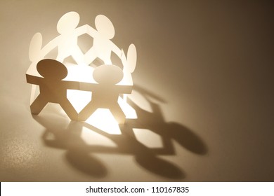 Team Of Paper Doll People In A Circle