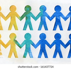Team of paper doll people holding hands