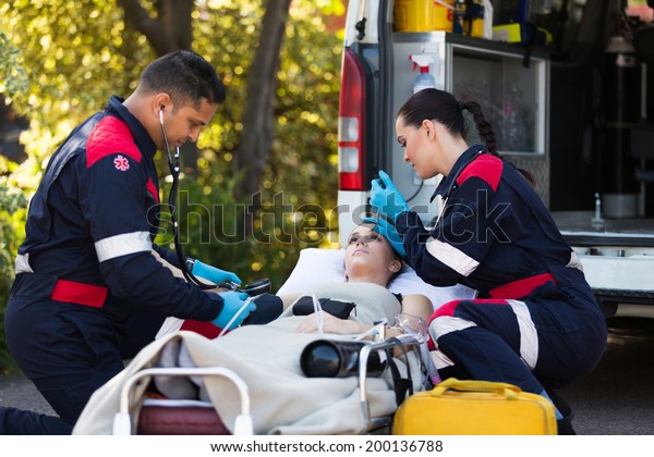 Team Paramedics Rescuing Young Patient Stock Photo (Edit Now) 200136788