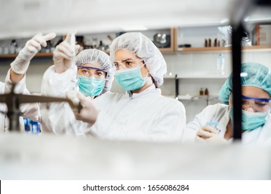 Team of pharmacist working on drug discovery.Development of new vaccine.Sterile cleanroom.Antivirus antidote immunization concept.Lab pre-clinic experiment.Disease biochemical analyisis.Diagnostics - Shutterstock ID 1656086284