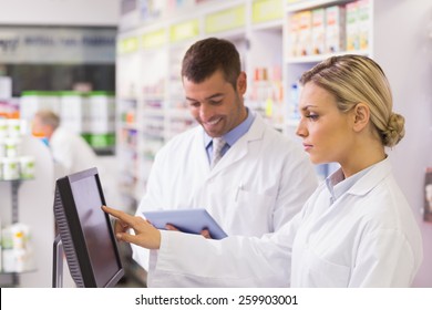 Team Of Pharmacists Using Computer At The Hospital Pharmacy