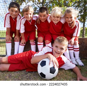 The team photo. Portrait of a childrens soccer team posing for the team photo. - Powered by Shutterstock