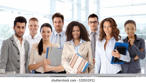 Team Portrait Of Young And Successful Business People Looking At Camera, Smiling.