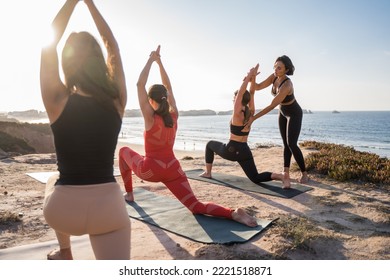 Team practicing at the ocean beach, training outdoor, teacher helping to student