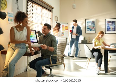 Team of professional designers working in office - Shutterstock ID 1653615355