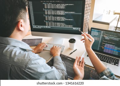 Team Of Professional Developer Programmer Cooperation Meeting And Brainstorming And Programming In Website Working A Software And Coding Technology, Writing Codes And Database.