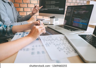 Team of Professional Developer programmer cooperation meeting and brainstorming and programming in website working a software and coding technology, writing codes and database. - Shutterstock ID 1369460255