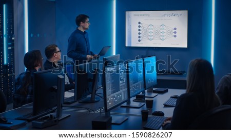 Team of Professional IT Developers Have Meeting, Speaker Talks about New Blockchain Based Software Development Shown on TV. Concept: Deep Learning, Artificial Intelligence, Data Mining, Neural Network