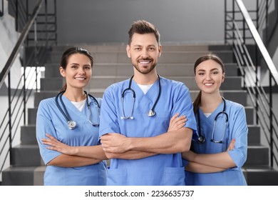 Team of professional doctors on staircase in clinic - Powered by Shutterstock