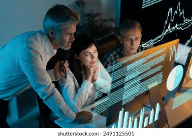 Team Of Professionals Analyzing Data On Multiple Monitors In A Modern Office, Collaborating And Brainstorming Solutions. Represents Data Analysis, Business Strategy, And Teamwork In The Digital Age.