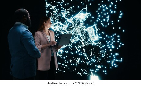 Team of programmers optimizing neural network neurons map with laptop and augmented reality tech, teamworking colleagues fine tuning AI model synaptic weights with notebook, camera A. - Powered by Shutterstock - Get 15% off with code: PIKWIZARD15