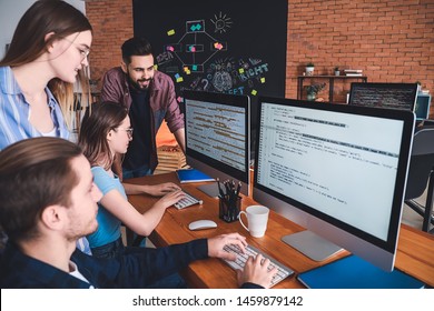 Team of programmers working in office
