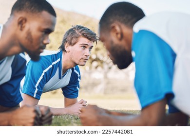 Team, push up and football player coaching on field training, practice and sports challenge with muscle support. Group, soccer people or men on grass or ground for workout fitness of personal trainer - Powered by Shutterstock