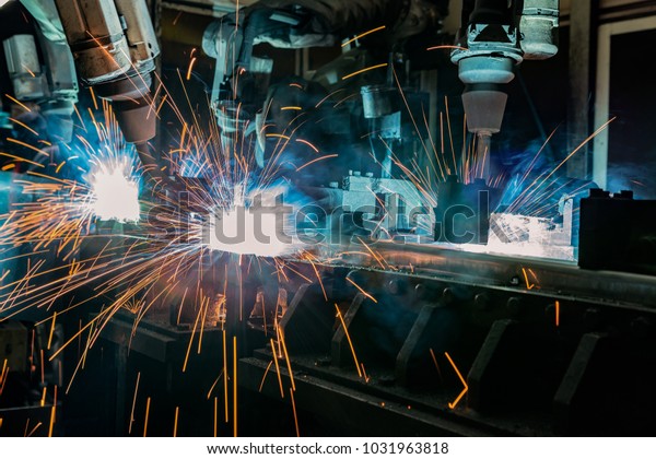 Team\
robots are welding assembly part in car\
factory\
