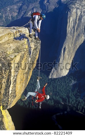 Similar – Rock climbing team bivouaced in a storm.