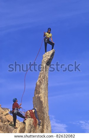 Similar – Climber reaching for a helping-hand.