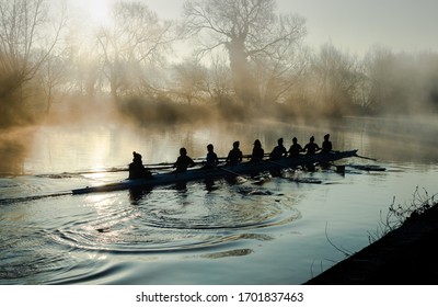 Team Rowing On A Mirror