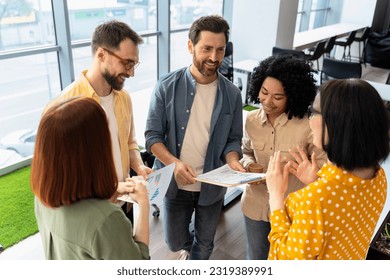 Team of smiling multiracial business people working in modern office, talking, cooperation, sharing ideas, planning startup. University students studying together. Meeting Teamwork Successful business - Powered by Shutterstock