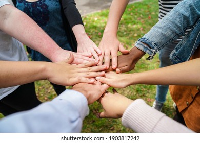 Team Stacking Hands In Unison