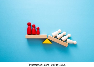 Team standing on a wooden seesaw, one side winner and one side loser. Success and failure. Business and workplace competition. - Shutterstock ID 2194615395