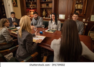 Team Of Successful Lawyer Or Businessman At A Meeting In The Office