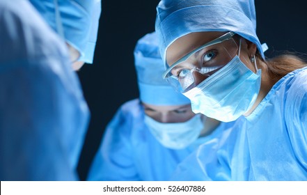 Team surgeon at work on operating in hospital - Shutterstock ID 526407886