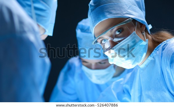 Team surgeon at\
work on operating in\
hospital
