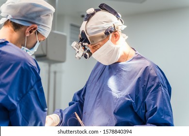 Team surgeon at work in operating room. Modern clinic. Health care concept. Closeup - Powered by Shutterstock