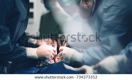 Team of surgeons make a dissection for aortic valve repair in cardiovascular minimally invasive surgery hospital center. Best health care managment in hospital with valve innovation minithoracotomy