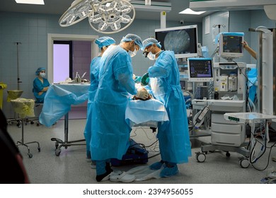 team of surgeons operate on the patient - Powered by Shutterstock