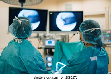 Team of surgeons operating in the hospital - Shutterstock ID 1442098271
