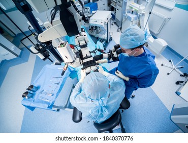 A team of surgeons performing brain surgery to remove a tumor. - Shutterstock ID 1840370776