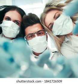 Team surgeons are performing an operation using medical instrum