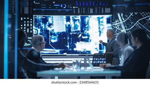 Team of Surveillance Experts Having a Discussion During a Meeting in an Advanced Research Center. Diverse Group of Professionals Monitoring an Active Operation with Satellite Tracking Technology - Powered by Shutterstock