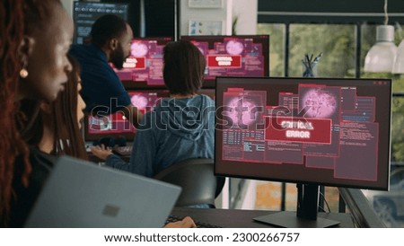 Team of system engineers having web server hacked, reading critical error on multiple monitors in office. Diverse software developers trying to solve hacking problem, firewall security.