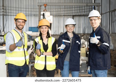 Team technician at work, wear safety uniform, glasses and helmet working  in the industry factory - Powered by Shutterstock