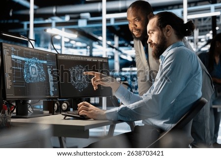 Team of technicians using PC in data center, integrating AI driven automation tools, doing maintenance. Server farm coworkers using artificial intelligence machine learning models