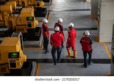 A Team Of Technicians Using Safety Equipment Is Performing Maintenance On A Diesel Engine At A Power Plant At A Private Power Plant In Bangka Belitung.  April 15th 2015