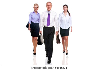 A Team Of Three Business People Walking Towards Camera, Isolated On A White Background.