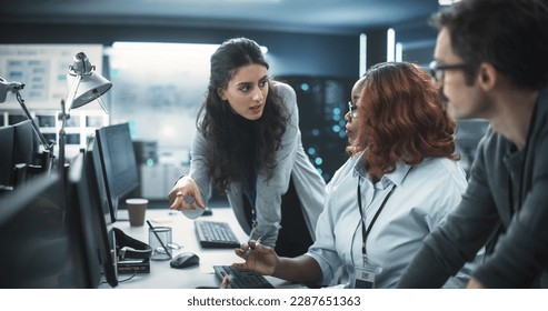 Team of Three Multiethnic Diverse Software Developers Talk, Discuss an AI Project. Empowered Black Female Specialists and Two Colleagues Work on Digital E-Commerce Startup Business - Powered by Shutterstock