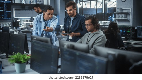 Team of Three Multiethnic Diverse Software Developers Talk, Discuss and Collaborate on an AI Project. Empowered Young Indian Specialists Work on Digital E-Commerce Startup Business - Powered by Shutterstock