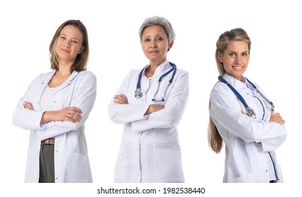 Team of three smiling female medical doctors with stethoscopes in white uniform isolated on white background