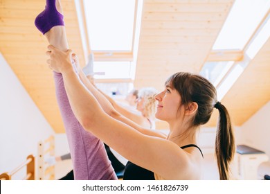 Team Of Three Sporty Female Workout Together In Studio Eco Modern Interior. Smiling Women At The Gym During Pilates Training With Trainer. Small Business, Owner Concept.