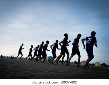 Team Training Of Young Boys On The Sunset Beach