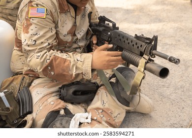 Team of U.S. Army marine corps soldier military war with gun weapon participating and preparing to attack the enemy in Thailand during exercise Cobra Gold training in battle. Combat force.
