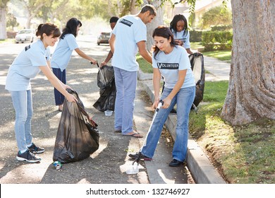 Team Of Volunteers Picking Up Litter In Suburban Street - Powered by Shutterstock