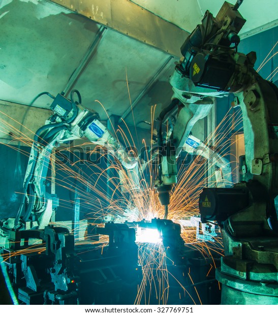 Team welding Robot movement Industrial automotive
part in factory
